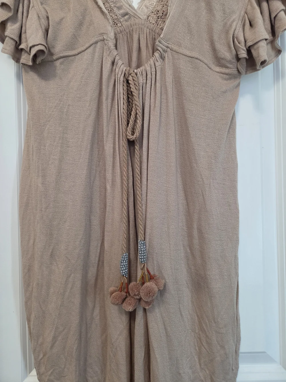 Boho Embroidered V-Neck High-Low Top with Ruffle Sleeves & Back Tie Tassels